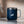 A blue mug with Kaldi's goat logo sits on a counter