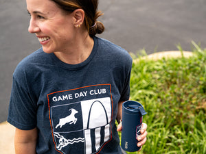 Front of the Game Day Tumbler v2 shirt with crest