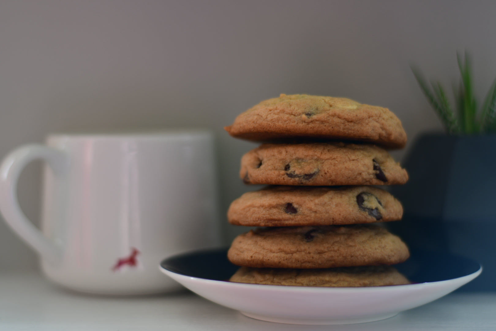 a stack of five chocolate chip cookies