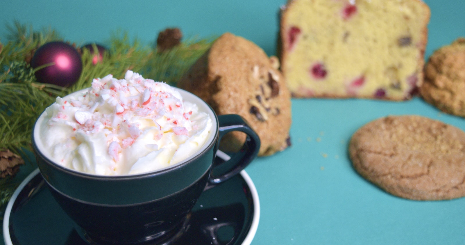 Holiday Mint Mocha with holiday pastries in the background