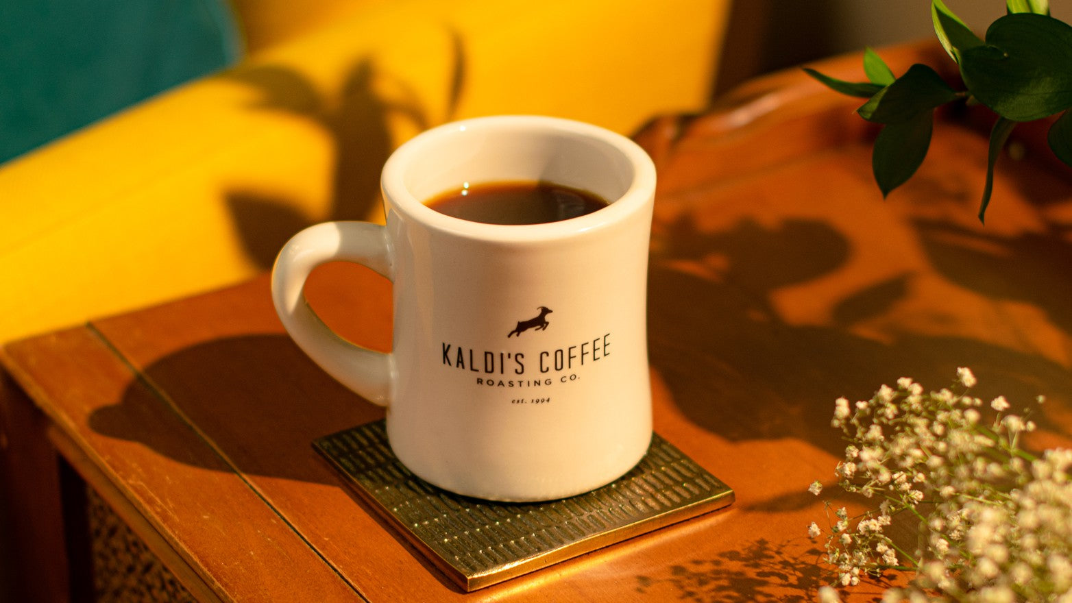 A Kaldi's Coffee diner mug resting on a table