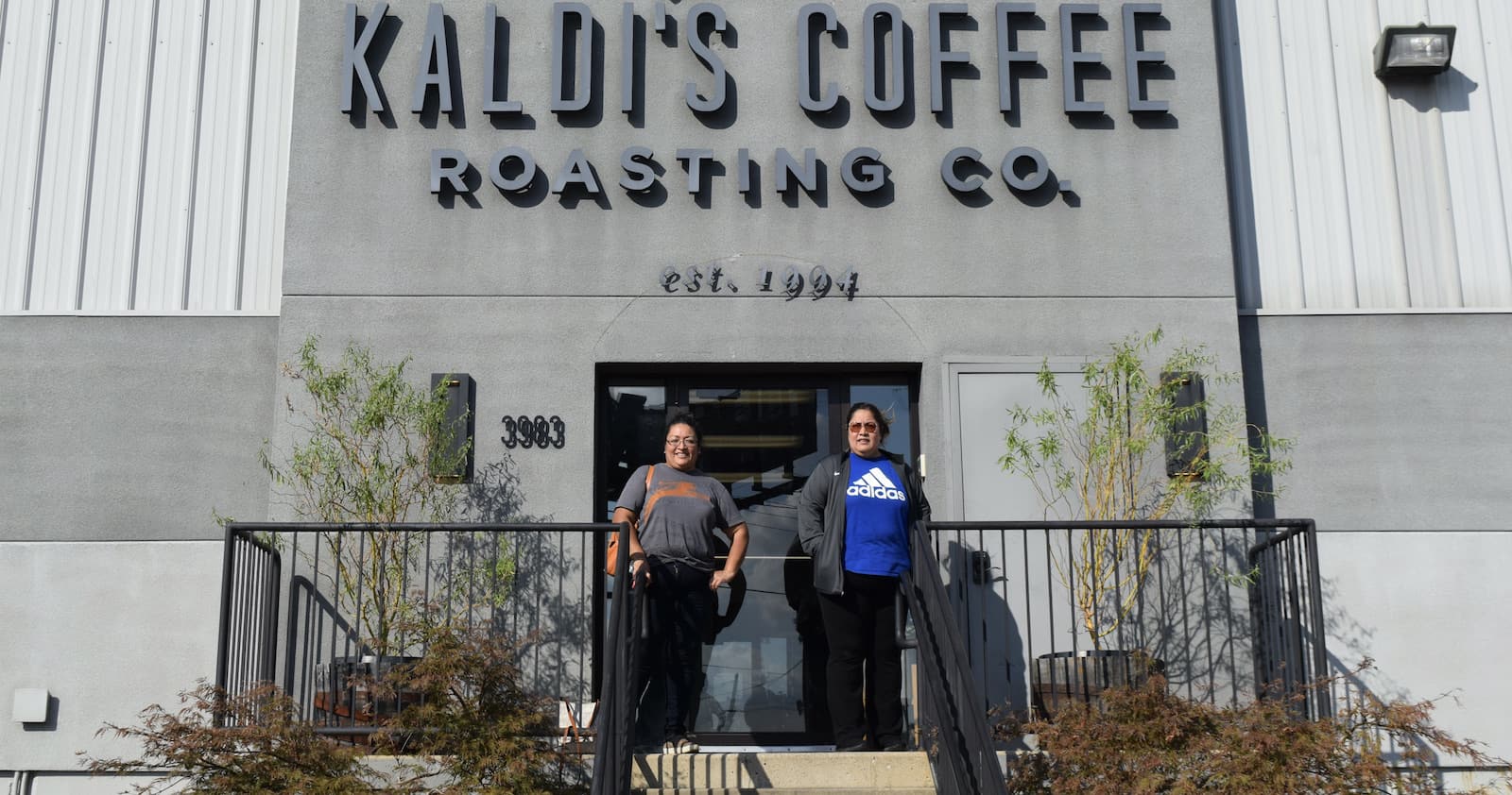 Maria and Lupe standing outside of the Kaldi's Coffee Roastery in St. Louis, MO