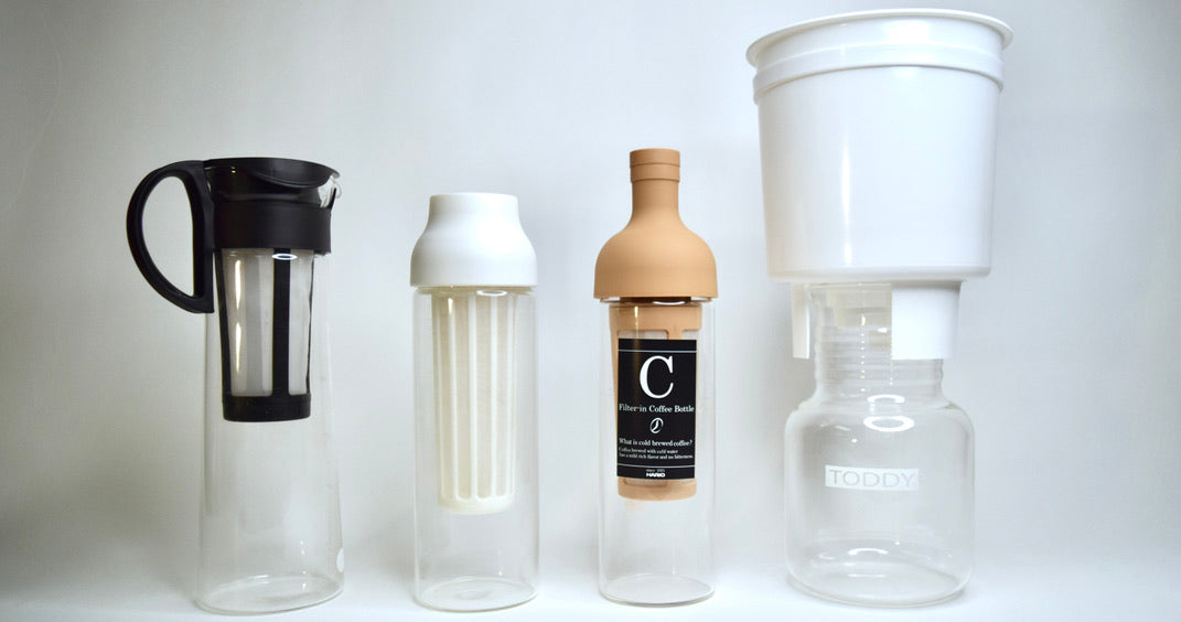 The Hario Mizudashi, Kinto Capsule, Hario Wine Bottle, and Toddy Cold Brew Maker in a row