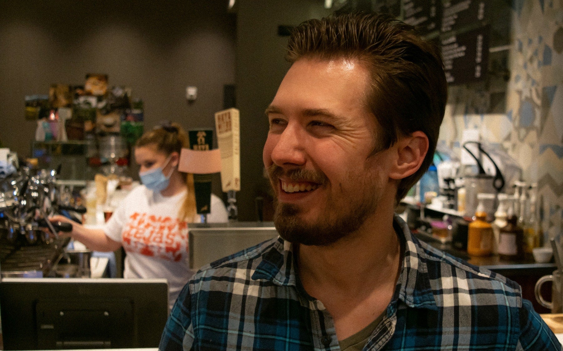 Phil Moll inside a Kaldi's Coffee cafe 