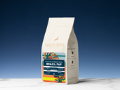Kaldi's Coffee bag with branding and product details on a blue background