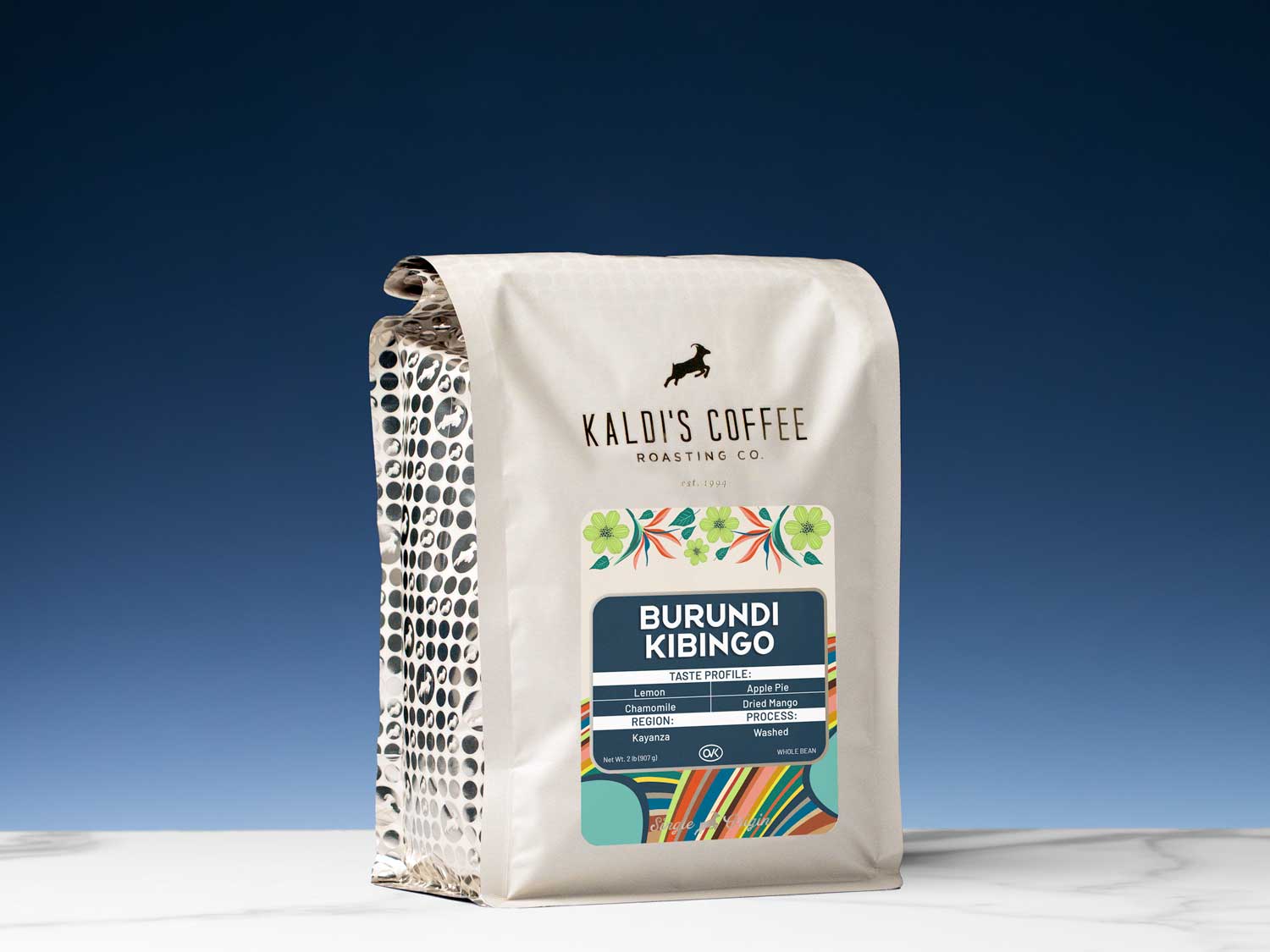 Kaldi's Coffee Roasting Co. coffee bag with colorful label on a blue background