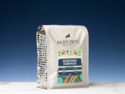 Kaldi's Coffee Roasting Co. coffee bag with colorful label on a blue background