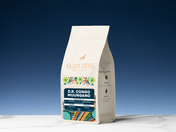 Kaldi Coffee Company coffee bag with colorful design on a blue background