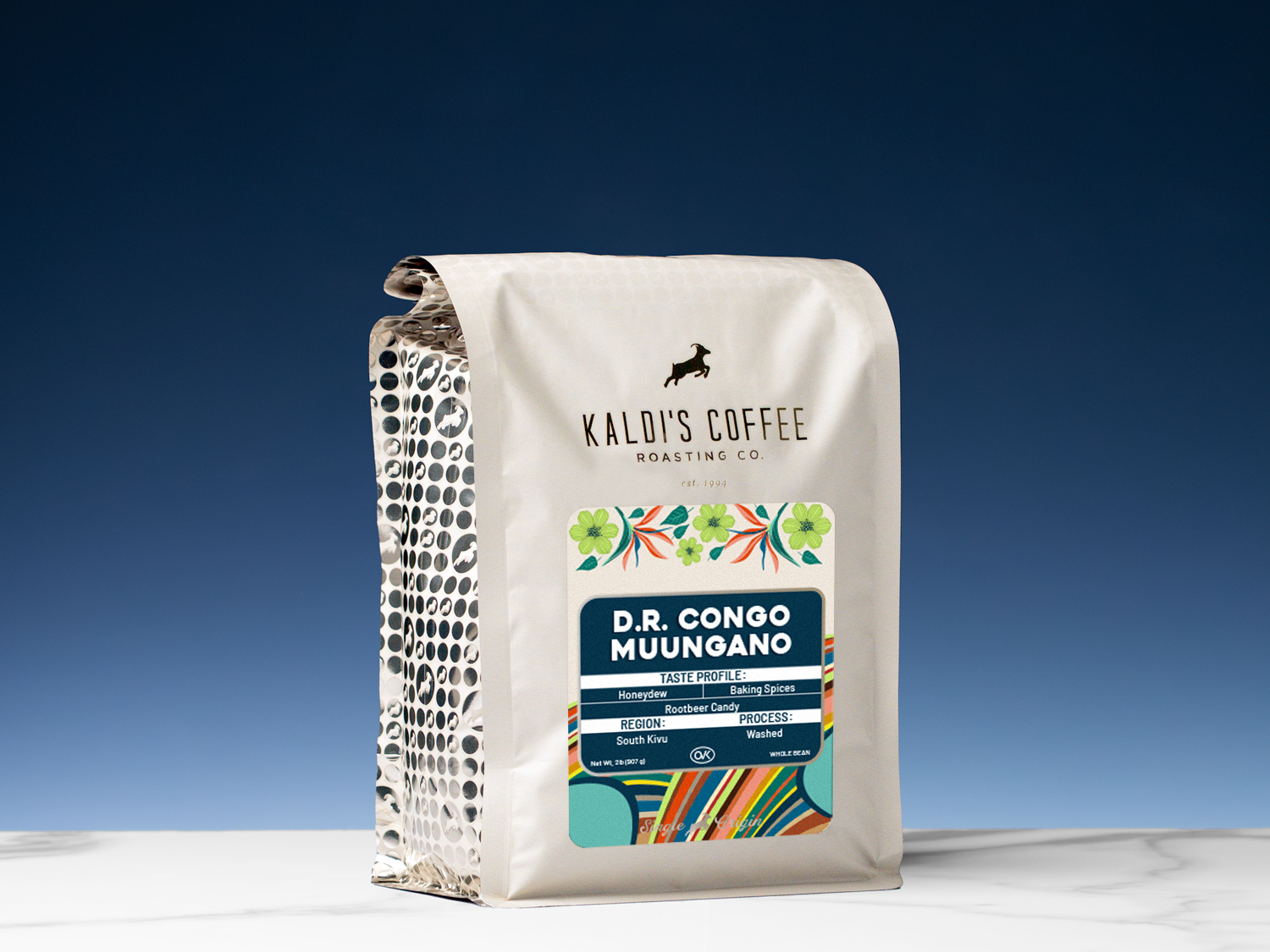 Kaldi's Coffee Roasting Co. coffee bag with colorful label on a blue background