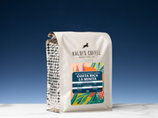 Kaldi's Coffee Costa Rica La Minita coffee bag on a blue gradient background