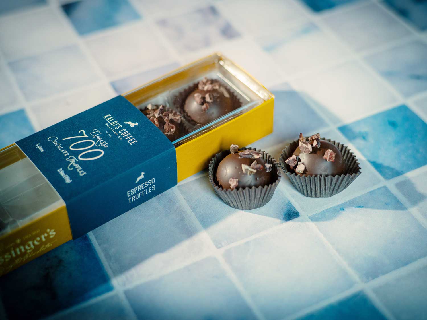 Truffles in a box on a tiled surface