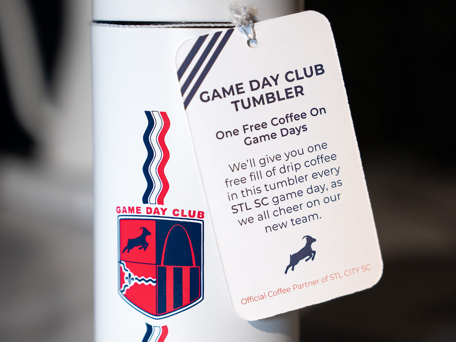 The Game Day Club Tumbler V3 with the tag, stating "Game Day Club Tumbler - One Free Coffee on Game Days - We'll give you one free fill of drip coffee in this tumbler ever STL SC game day, as we all cheer on our new team