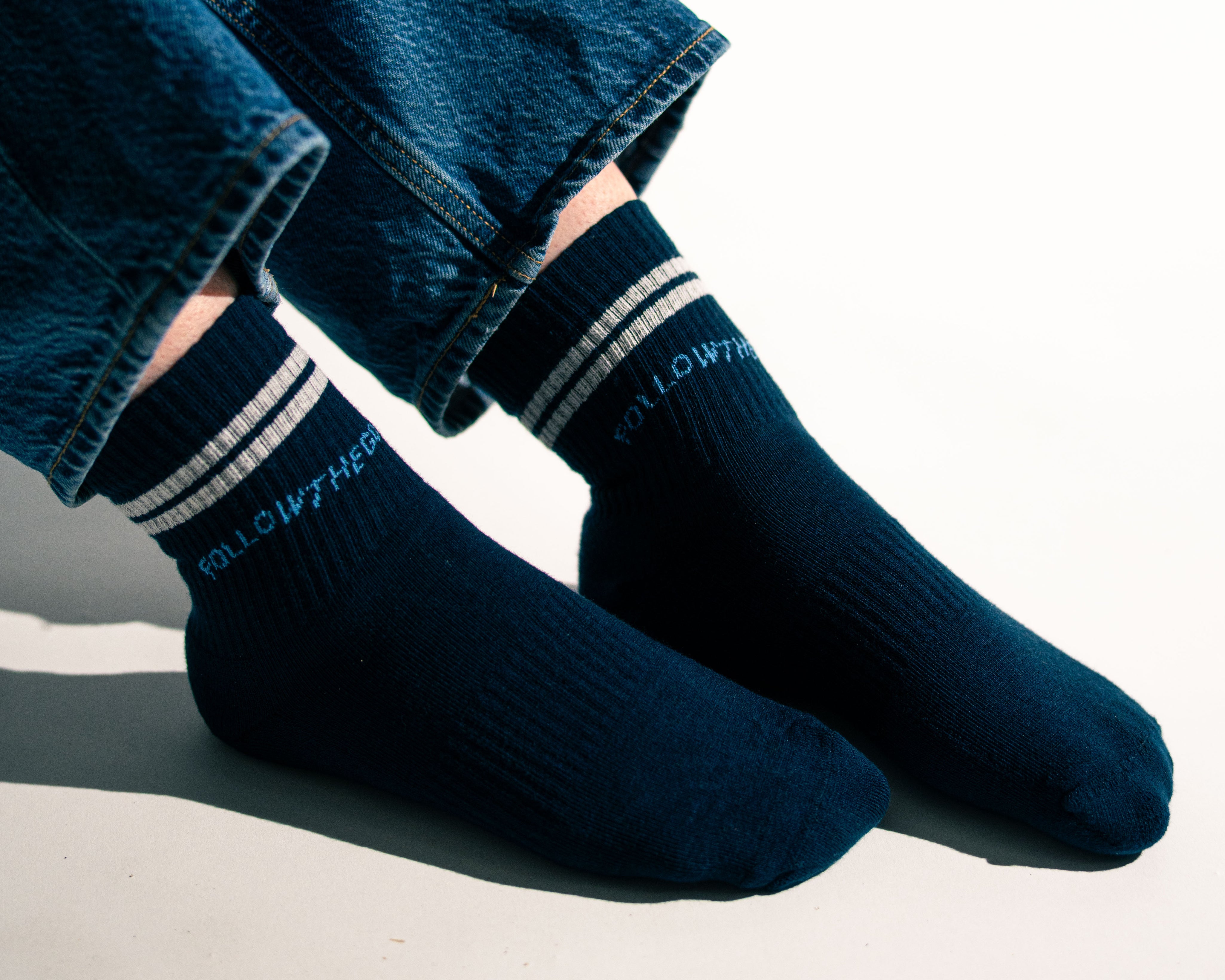 side view of model wearing navy socks