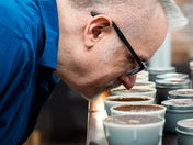 Dale getting the aroma from a coffee cupping bowl
