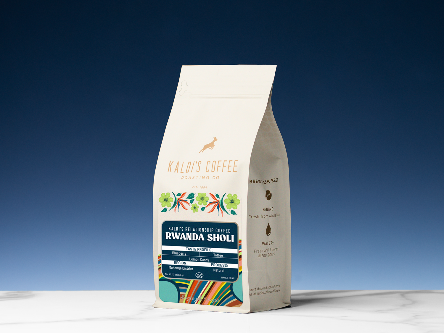 Kaldi's Coffee Rwanda Sholi coffee bag on a white surface with a blue gradient background