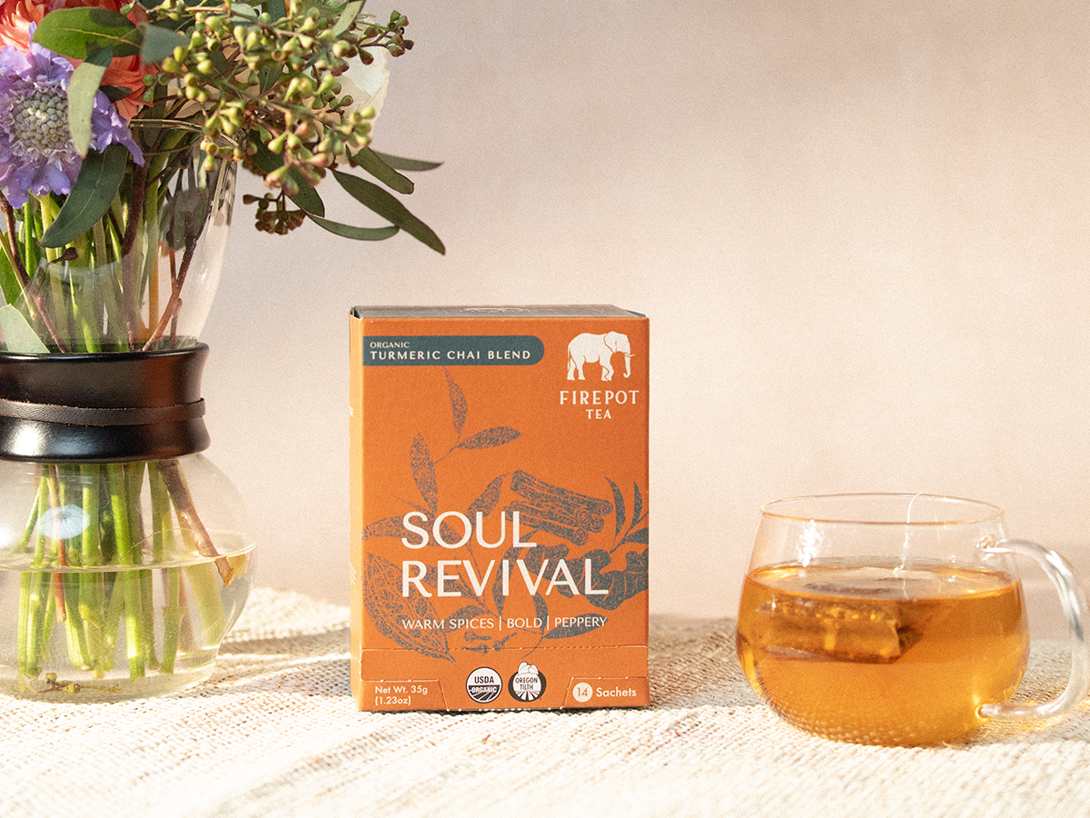 soul revival box and glass mug of gold tea