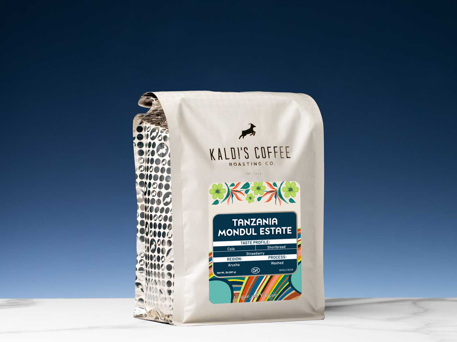 Kaldi's Coffee Roasting Co. coffee bag with colorful label on a blue background