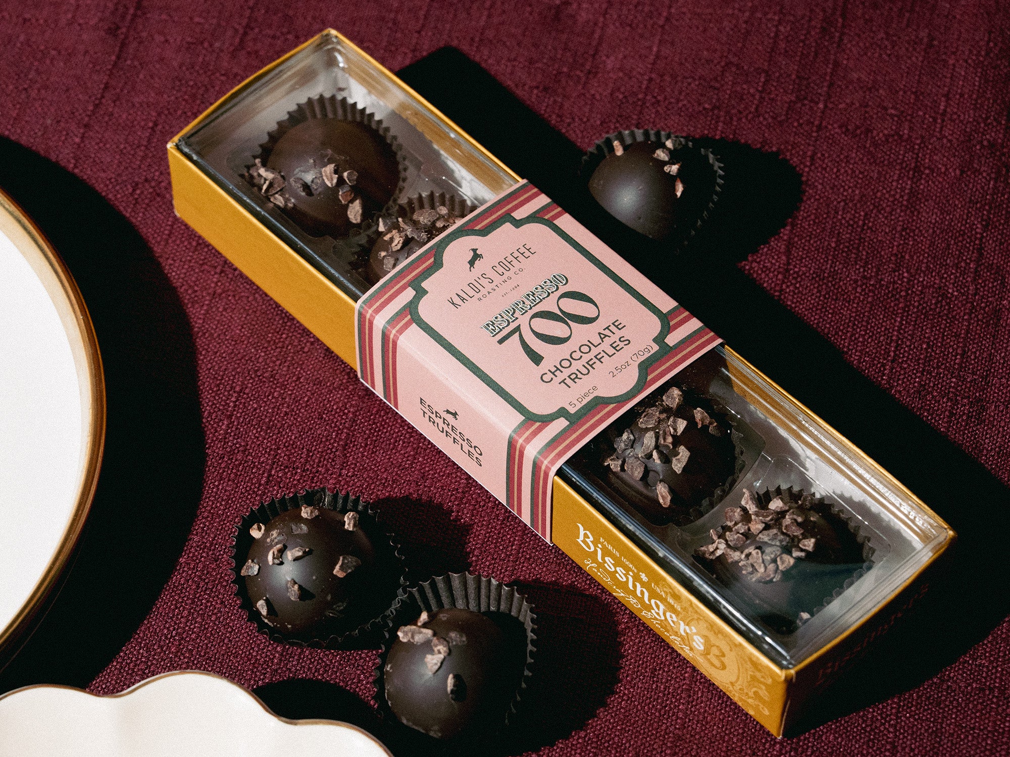 Box of chocolate truffles on a dark surface