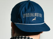 Blue cap with 'FOLLOWTHEGOAT' text and logo on a plain background