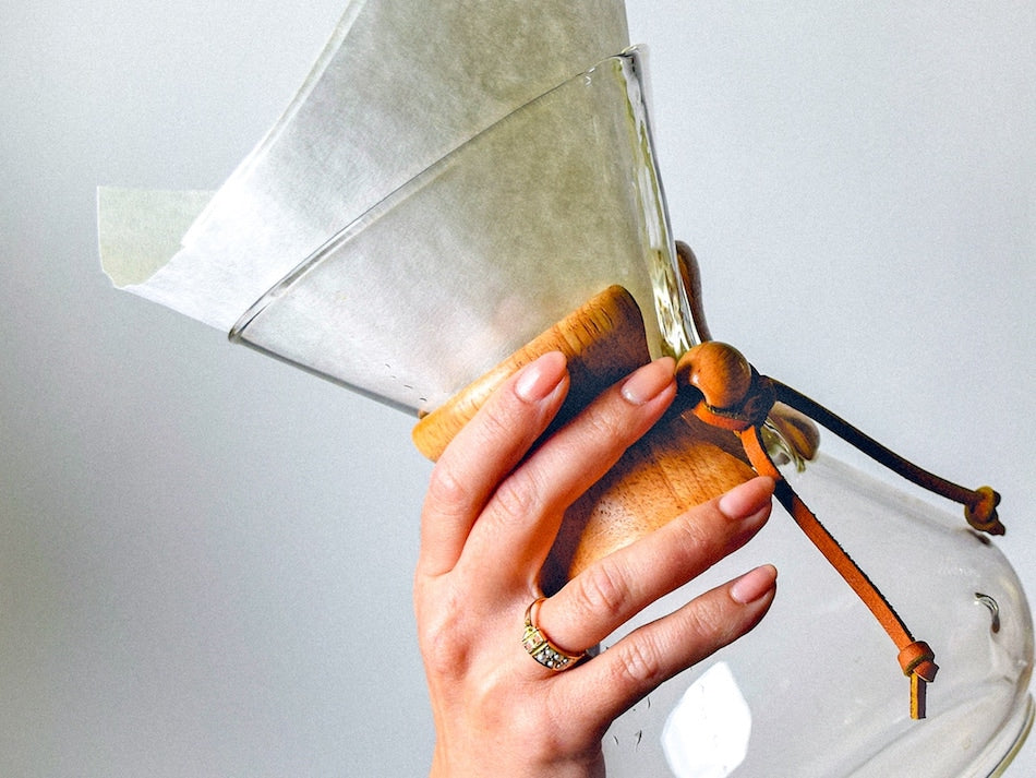 hand holding a chemex brewer