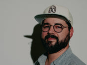 Male wearing snap back grandpa style hat