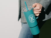 image of model holding Kaldi's Miir Staw Cup