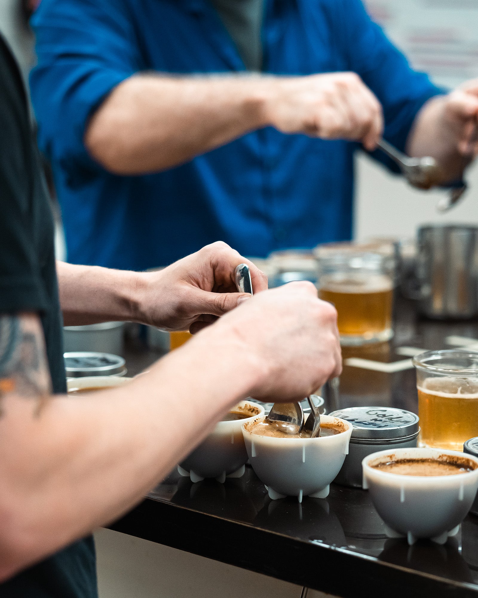 Breaking the crust of coffee cupping bowls in the Kaldi's Coffee Cupping Room